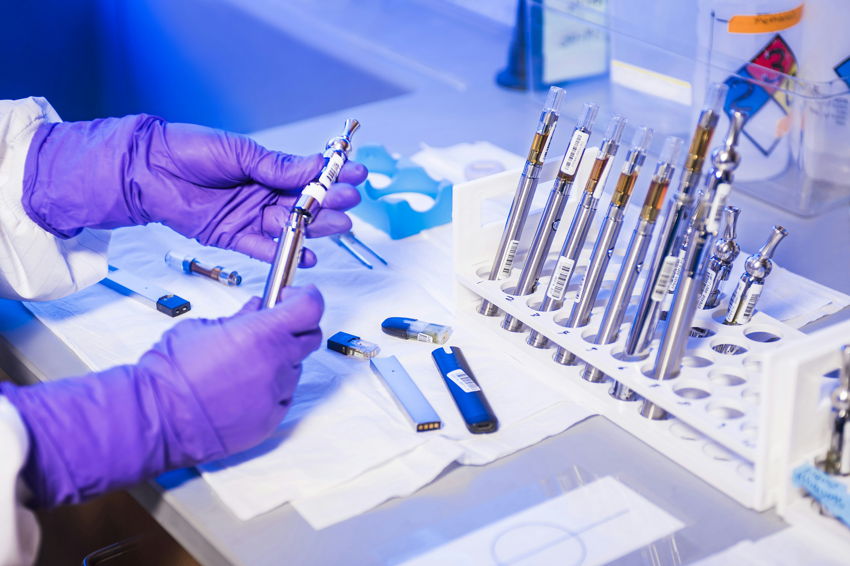 Laboratory precision pipetting in blue lighting
